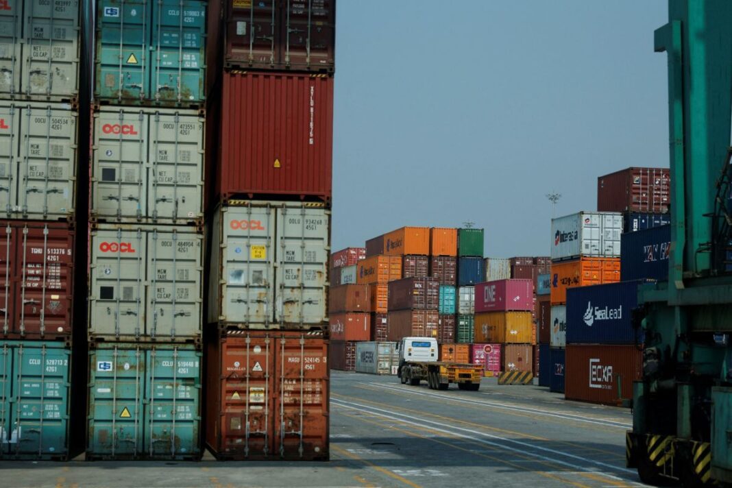 Shipping containers are stored at APM Terminals, in Navi Mumbai