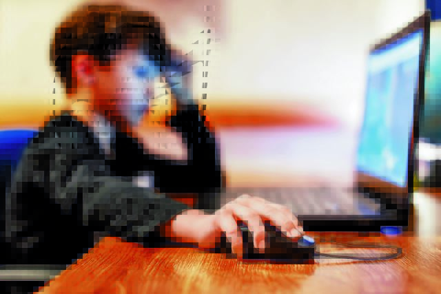 Little,Addicted,Boy,Playing,Video,Game,On,Laptop,At,Home