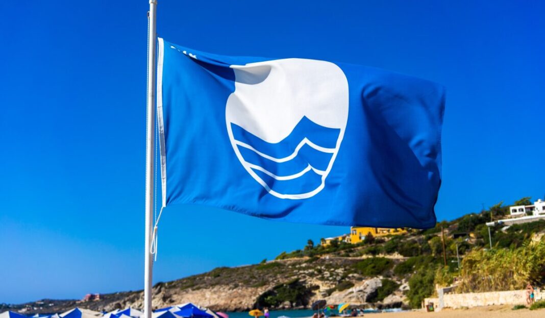 Blue,Flag,Beach,Of,Crete