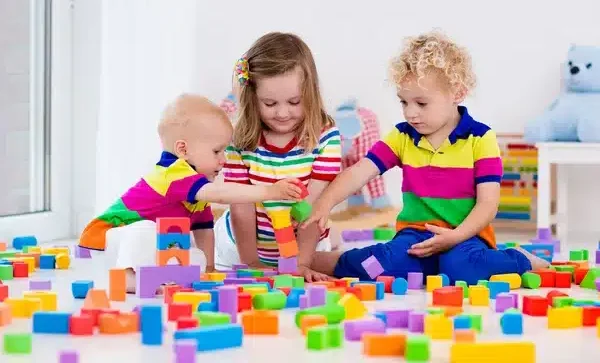 kids-playing-with-colorful-toy-e1719838287345